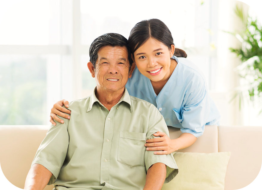 elderly man and staff smiling